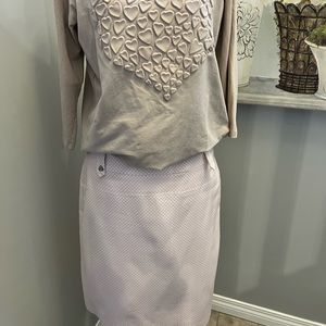 Light pink skirt with white delicate pattern. Size Medium.